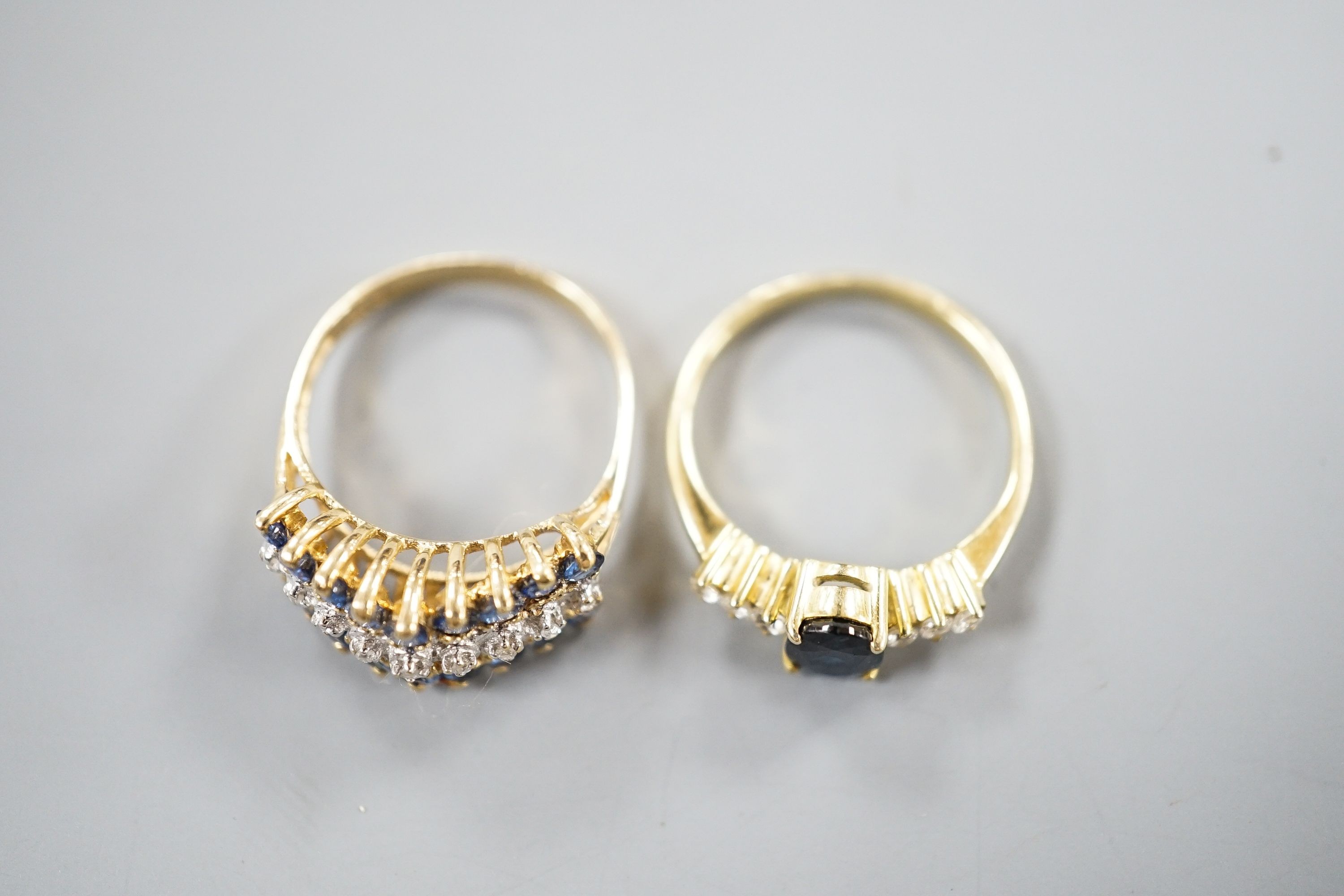 Two modern 14k yellow metal, sapphire and diamond set dress rings, sizes L & K/L, gross weight 5.1 grams.